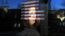 RNPS IMAGES OF THE YEAR 2012 - An audience member looks out a window while waiting for Republican presidential candidate and former Massachusetts Governor Mitt Romney at a campaign rally in Reno, Nevada February 2, 2012. REUTERS/Brian Snyder (UNITED STATES - Tags: POLITICS ELECTIONS USA PRESIDENTIAL ELECTION TPX IMAGES OF THE DAY) Published: Pro. 5, 2012, 11:17 odp.