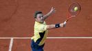 Stan Wawrinka of Switzerland stretches out to return a backhand to Guillermo Garcia-Lopez of Spain during their men's singles match at the French Open tennis tournament a