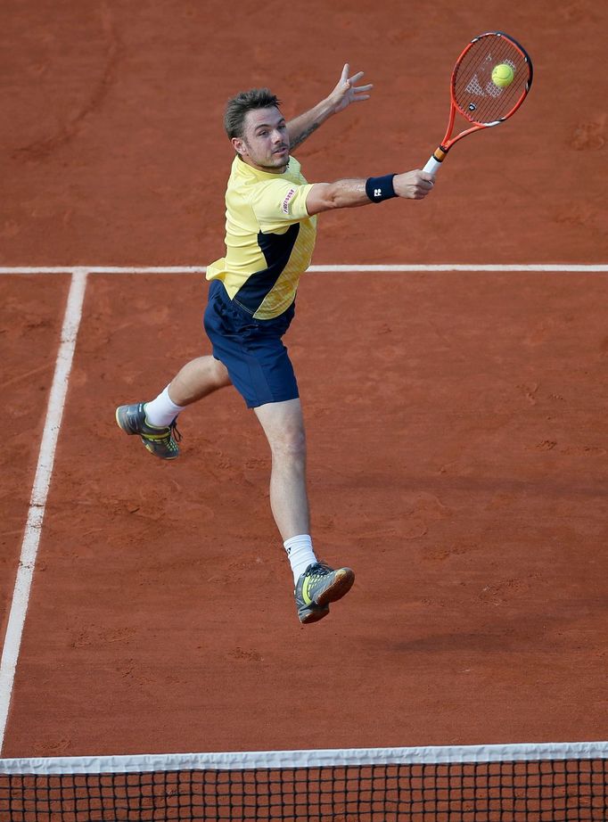 Stan Wawrinka of Switzerland stretches out to return a backhand to Guillermo Garcia-Lopez of Spain during their men's singles match at the French Open tennis tournament a