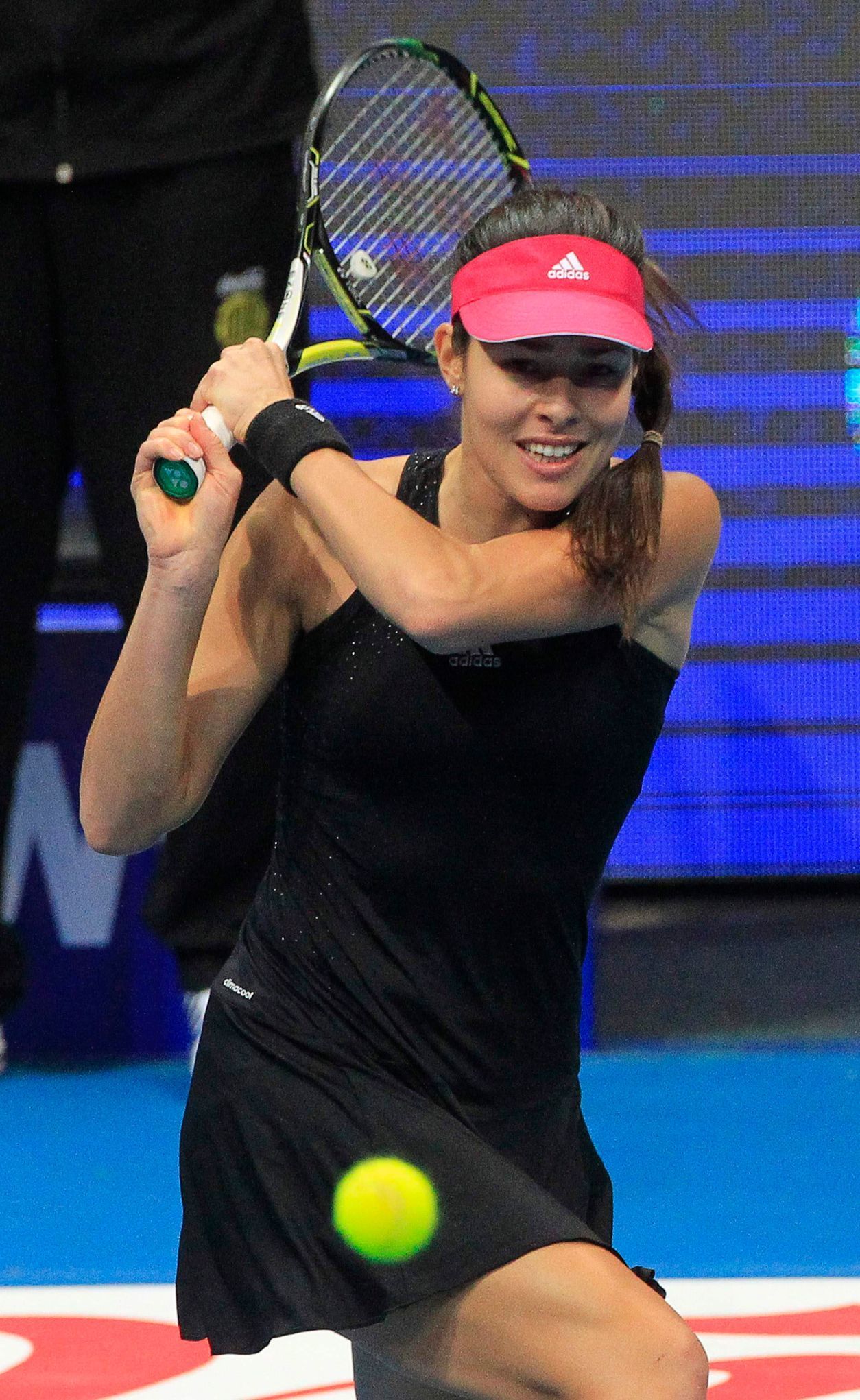 Ivanovic of the Indian Aces returns a shot to Mladenovic of the UAE Royals during their women's single match at the International Premier Tennis League (IPTL) in Manila