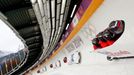 Russia's pilot Alexander Zubkov and his teammates speed down the track during a four-man bobsleigh training session at the Sanki Sliding Center in Rosa Khutor, during the