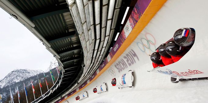 Russia's pilot Alexander Zubkov and his teammates speed down the track during a four-man bobsleigh training session at the Sanki Sliding Center in Rosa Khutor, during the