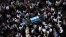 People carry the coffin of 13-year-old Juan Armando Coy Cal, who was killed by a man in his primary school classroom, on the streets of Tactic, in the Alta Verapaz region, some 189 km (117 miles) from Guatemala City, September 14, 2012. Angry villagers in Guatemala killed a man by setting fire to him after he hacked 8-year-old Evelyn Yanisa Saquij Bin and Armando Coy Cal to death with a machete in a school on September 12. The two children were buried today in a municipal cemetery. REUTERS/Jorge Dan Lopez (GUATEMALA - Tags: CRIME LAW SOCIETY) Published: Zář. 15, 2012, 4:18 dop.