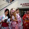 People walk out of a Japanese supermarket in the Little Tokyo area of Los Angeles