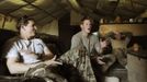 Britain's Prince Harry (C) plays a computer soccer game with his fellow Apache pilot Captain Simon Beattie (L) at Camp Bastion, southern Afghanistan in this photograph taken November 3, 2012, and released January 21, 2013. The Prince, who is serving as a pilot/gunner with 662 Squadron Army Air Corps, is on a posting to Afghanistan that runs from September 2012 to January 2013. Photograph taken November 3, 2012. REUTERS/John Stillwell/Pool (AFGHANISTAN - Tags: MILITARY POLITICS SOCIETY MEDIA ROYALS CONFLICT) Published: Led. 21, 2013, 7:51 odp.