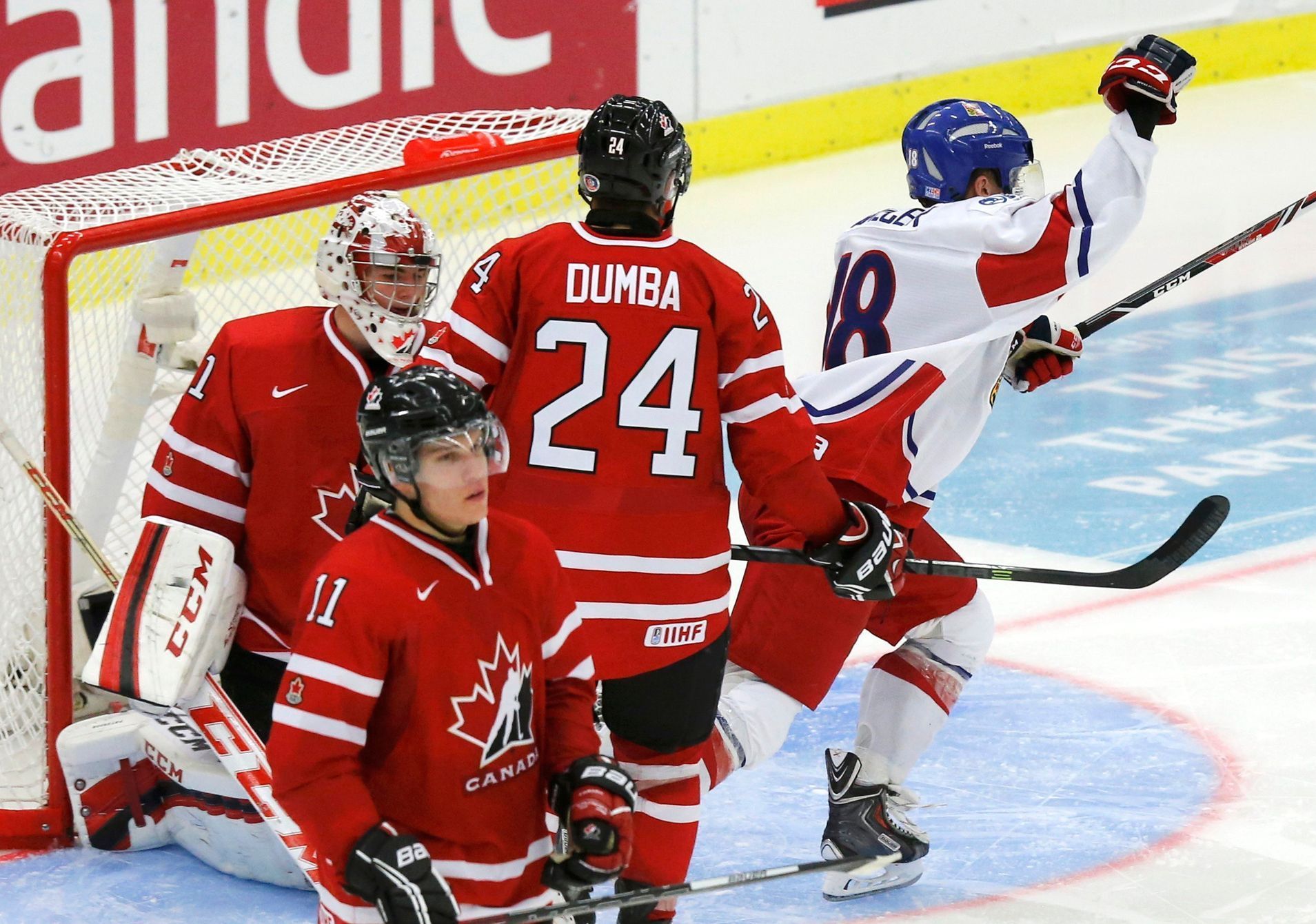 Czech Republic's Tomecek celebrates his goal in front of Canada's goalie Paterson, Horvat and Dumba during the third period of their IIHF World Junior Championship ice hockey game in Malmo