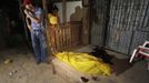 Family members react while standing next to the body of a woman who was shot dead by two gunmen on a motorcycle in San Pedro Sula March 20, 2013. San Pedro Sula, the country's second largest city after Tegucigalpa, has a homicide rate of 169 per 100,000 people and was named the world's most violent city for a second year in a row. Lax laws allow civilians to own up to five personal guns. Arms trafficking has flooded the country with nearly 70% illegal firearms. 83.4% of homicides are by firearms, compared to 60% in the United States. Picture taken March 20, 2013. REUTERS/Jorge Cabrera (HONDURAS - Tags: CRIME LAW CIVIL UNREST HEALTH) ATTENTION EDITORS: PICTURE 6 OF 39 FOR PACKAGE 'GUN CULTURE - HONDURAS' SEARCH 'HONDURAS GUN' FOR ALL IMAGES Published: Dub. 5, 2013, 11:14 dop.