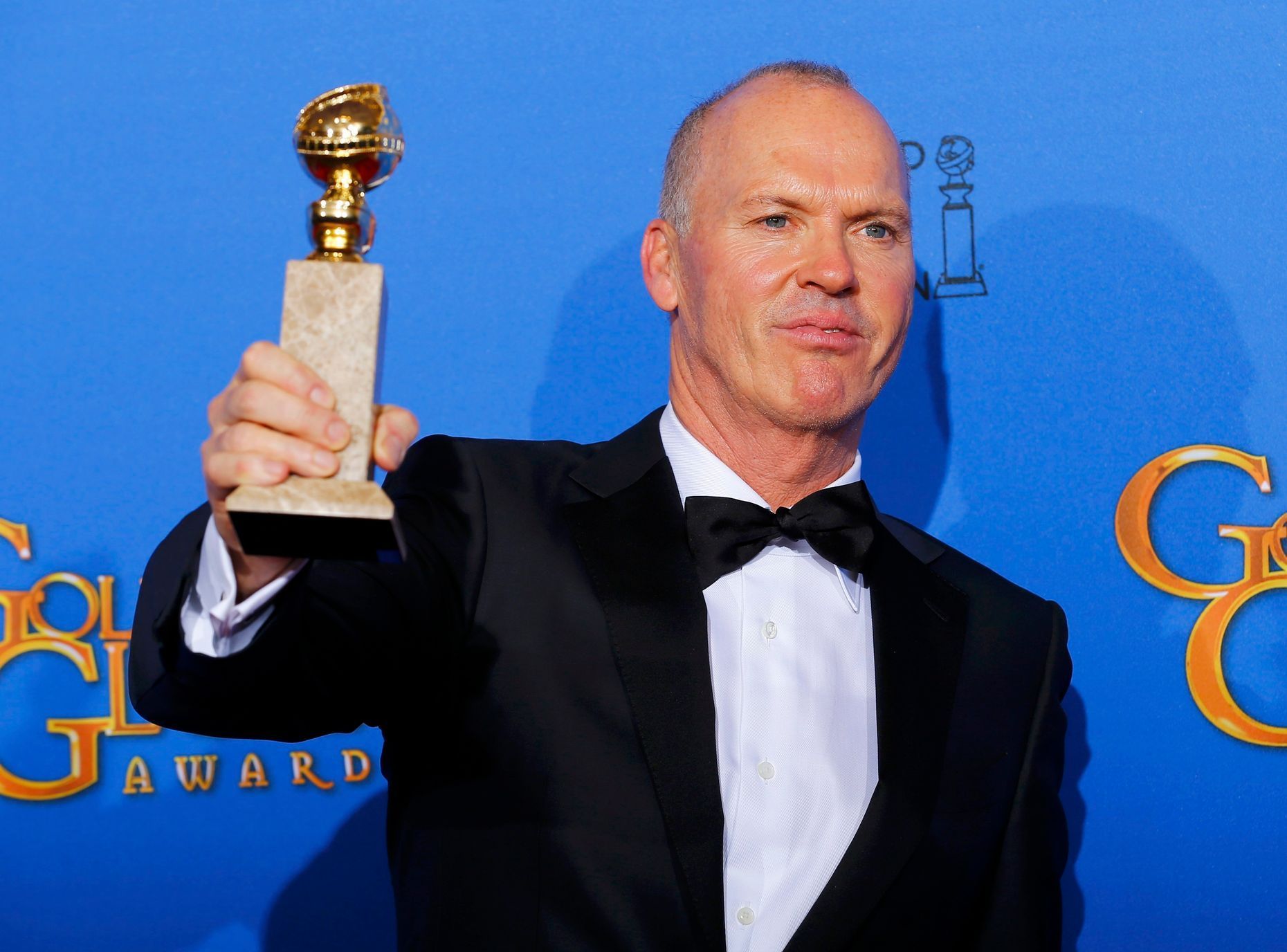 Michael Keaton poses backstage with his award for Best Actor in a Motion Picture, Musical or Comedy for his role in &quot;Birdman&quot; at the 72nd Golden Globe Awards in Beverly Hills