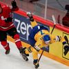 Switzerland's Niederreiter fights for the puck with Sweden's