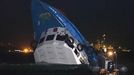 Rescuers approach a partially-submerged boat after two vessels collided in Hong Kong October 1, 2012. A major rescue is underway in the waters near Yung Shue Wan on Hong Kong's Lamma island following a collision involving two vessels in the evening, government radio reported on Monday. Police say there were about 100 people onboard both vessels, with many of them in the water. REUTERS/Tyrone Siu (CHINA - Tags: DISASTER TRANSPORT TPX IMAGES OF THE DAY) Published: Říj. 1, 2012, 6:38 odp.