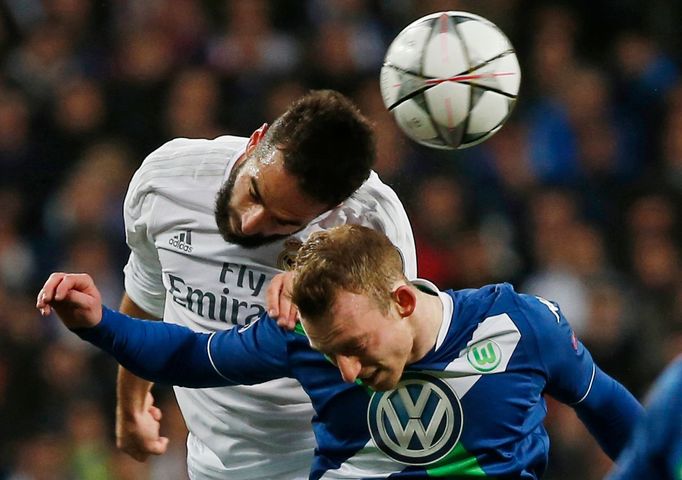 Real Madrid's Daniel Carvajal in action with Wolfsburg's Maximilian Arnold