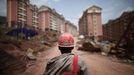 A labourer walks at a construction site where houses will be raised for people who will be relocated in Badong, on the banks of the Yangtze River, 100km (62 miles) from the Three Gorges dam in Hubei province in this August 7, 2012 file photo. China relocated 1.3 million people during the 17 years it took to complete the Three Gorges dam. Even after finishing the $59 billion project last month, the threat of landslides along the dam's banks will force tens of thousands to move again. It's a reminder of the social and environmental challenges that have dogged the world's largest hydroelectric project. While there has been little protest among residents who will be relocated a second time, the environmental fallout over other big investments in China has become a hot-button issue ahead of a leadership transition this year. Picture taken on August 7, 2012. To match story CHINA-THREEGORGES/ REUTERS/Carlos Barria/Files (CHINA - Tags: POLITICS ENVIRONMENT BUSINESS ENERGY EMPLOYMENT) Published: Srp. 22, 2012, 8:28 odp.