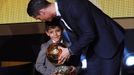 Real Madrid's Cristiano Ronaldo of Portugal, stands with his son Cristiano Ronaldo Jr, after winning the FIFA Ballon d'Or 2014 during the soccer awards ceremony at the Ko