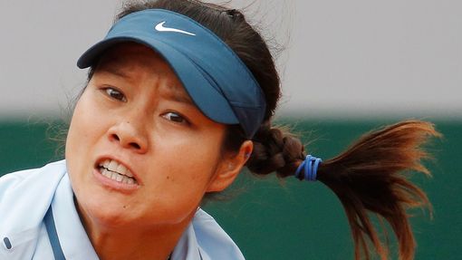 Li Na of China is pictured as she serves to Bethanie Mattek-Sands of the U.S. during their women's singles match at the French Open tennis tournament at the Roland Garros
