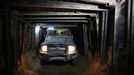 Palestinian workers ride a four-wheel vehicle inside a huge tunnel for smuggling cars and spare parts beneath the border between Egypt and southern Gaza Strip in Rafah . by Wissam Nassar.