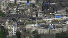 An aerial view shows houses damaged after a strong earthquake in Lushan county, Ya'an, Sichuan province, April 20, 2013. At least fifty-six people were killed and more than 500 others injured in the earthquake, according to Xinhua News Agency. REUTERS/China Daily (CHINA - Tags: DISASTER ENVIRONMENT) CHINA OUT. NO COMMERCIAL OR EDITORIAL SALES IN CHINA Published: Dub. 20, 2013, 6:08 dop.