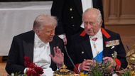 US President Donald Trump and King Charles interact at the state banquet for the US President and First Lady Melania Trump at Windsor Castle, Berkshire, on day one of the