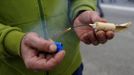 A miner on strike lights a firecracker on the A-6 motorway, on the second day of a strike to protest the government's spending cuts in the mining sector, in El Montico, near Oviedo, northern Spain, May 24, 2012. Spain's economy is contracting for the second time since late 2009 and four years of stagnation and recession have pushed unemployment above 24 percent, the highest rate in the European Union. REUTERS/Eloy Alonso (SPAIN - Tags: CIVIL UNREST BUSINESS EMPLOYMENT ENERGY) Published: Kvě. 24, 2012, 1:48 odp.