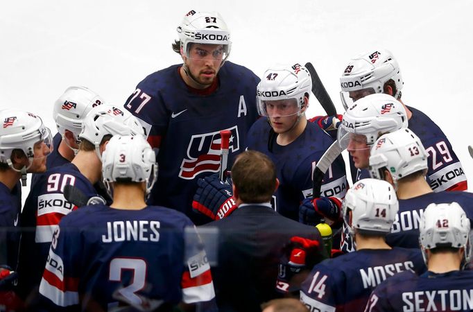 Head coach Todd Richards of the U.S. (C) talks to his players during a time out during their ice hockey World Championship game against Russia at the CEZ Arena in Ostrava