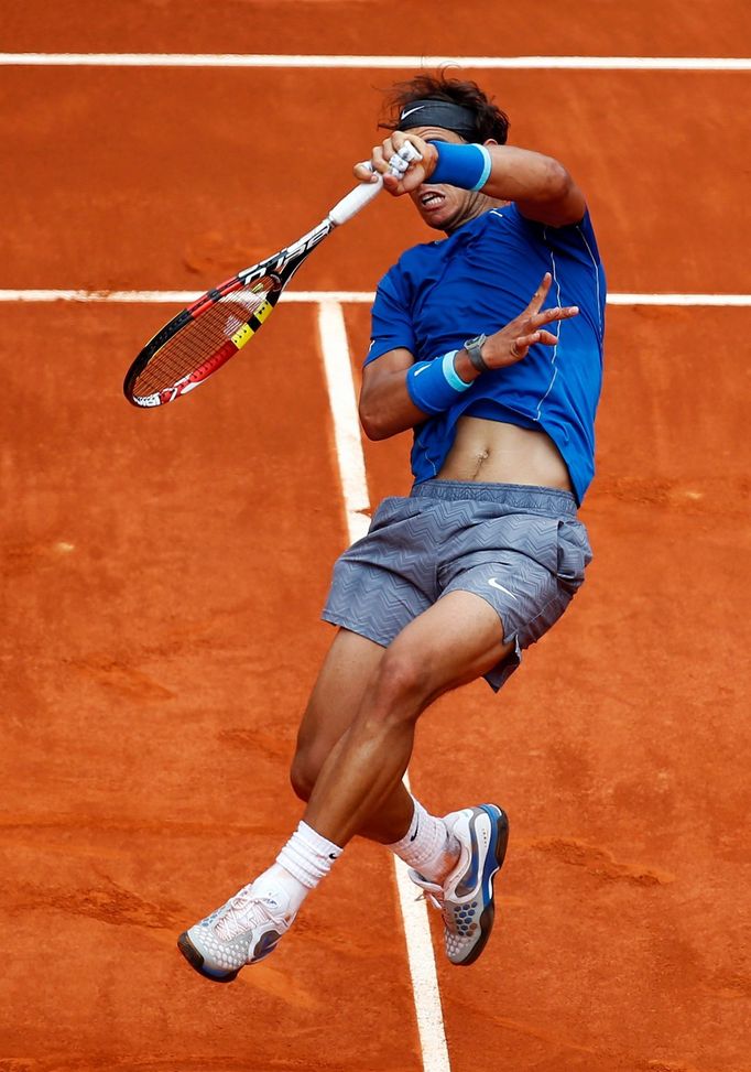 Nadal of Spain returns the ball to Monaco of Argentina during their match at the Madrid Open tennis tournament