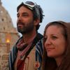 Dan Parras, left, and Melissa Bauman wait for the sun to rise at the Temple of Grace during the Burning Man 2014 &quot;Caravansary&quot; arts and music festival in the Black Rock Desert of Nevada