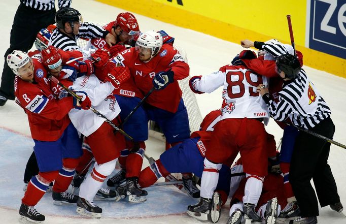 Players of Denmark and Norway fight during the second period of their men's ice hockey World Championship Group A game at Chizhovka Arena in Minsk May 11, 2014. REUTERS/V