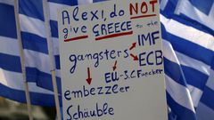 "Alexi, nedávej Řecko gangsterům..." Jeden z plakátů protestujících v Aténách.