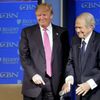 FILE PHOTO: U.S. Republican presidential candidate Donald Trump is greeted by Pat Robertson at a campaign event at Regents University in Virginia Beach