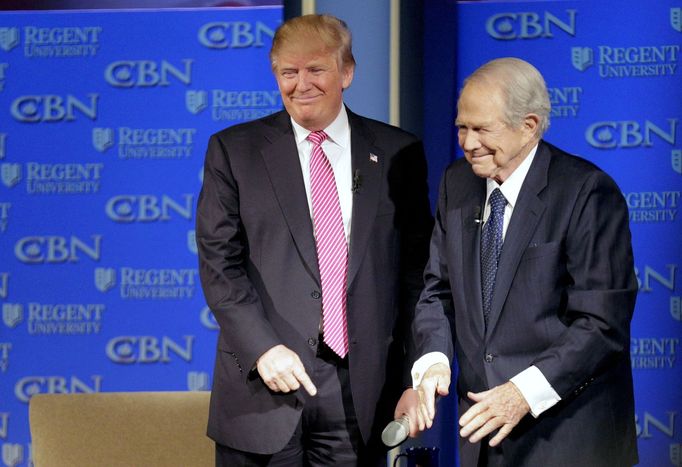 FILE PHOTO: U.S. Republican presidential candidate Donald Trump (L) is greeted by Pat Robertson at a campaign event at Regents University in Virginia Beach, Virginia Febr