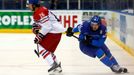 Jiri Sekac of the Czech Republic (L) is chased by by Italy's Brian Ihnacak (R) during the second period of their men's ice hockey World Championship Group A game at Chizh