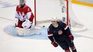 Team USA's T.J. Oshie (R) reacts after scoring the game-winning shootout goal against Russia's goalie Sergei Bobrovski during their men's preliminary round ice hockey gam