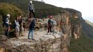 Britain's Prince William looks over the edge of a cliff as he and his wife Catherine, Duchess of Cambridge, visit the Narrow Neck Lookout  after visiting the Narrow Neck