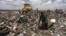 Men collect recyclable cans and bottles at a garbage disposal site near Sanaa