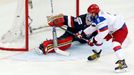 Russia's Alexander Ovechkin (R) scores a penalty past goaltender Tim Thomas of the U.S. during the first period of their men's ice hockey World Championship group B game