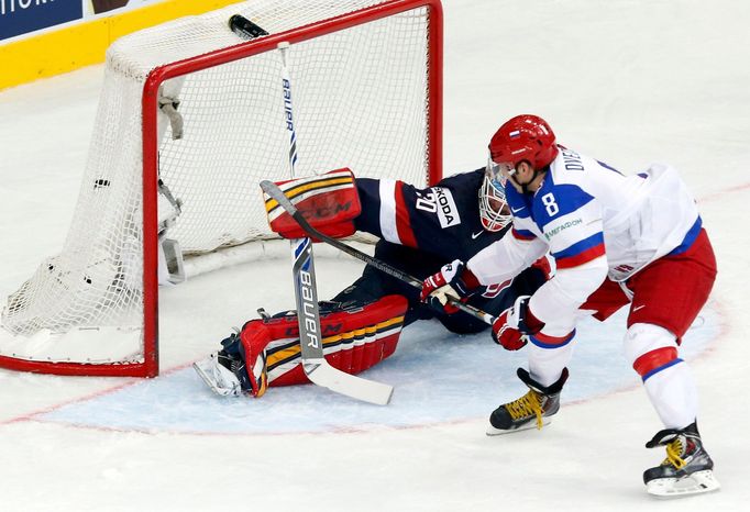 Russia's Alexander Ovechkin (R) scores a penalty past goaltender Tim Thomas of the U.S. during the first period of their men's ice hockey World Championship group B game