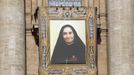 The tapestry of Maria Guadalupe Garcia Zavala hangs on Saint Peter's Basilica during a canonization mass led by Pope Francis at the Vatican May 12, 2013. The Pope leads a mass on Sunday for Antonio Primaldo, mother Laura Montoya and Maria Guadalupe Garcia Zavala.