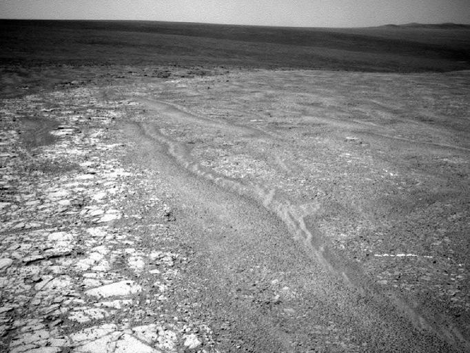 Western Edge of 'Cape York,' with Bright Vein The navigation camera on NASA's Mars Exploration Rover Opportunity recorded this view of the western edge of "Cape York" during the 2,761st Martian day, or sol, of the rover's work on Mars (Oct. 30, 2011). Cape York is a segment of the rim of Endeavour Crater. A bright vein, informally named "Homestake," is visible on the right side of the image. The vein is about as wide as a thumb and about 18 inches (45 centimeters) long. Opportunity examined it in November 2011 and found it to be rich in calcium and sulfur, possibly the calcium-sulfate mineral gypsum. Image Credit: NASA/JPL-Caltech