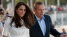 Catherine, Britain's Duchess of Cambridge, arrives with Australian Prime Minister Tony Abbott at Manly beach in Sydney