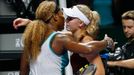 Serena Williams of the U.S. is congratulated by Caroline Wozniacki of Denmark during their WTA Finals singles semi-final tennis match at the Singapore Indoor Stadium Octo