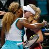Serena Williams of the U.S. is congratulated by Caroline Wozniacki of Denmark during their WTA Finals singles semi-final tennis match at the Singapore Indoor Stadium
