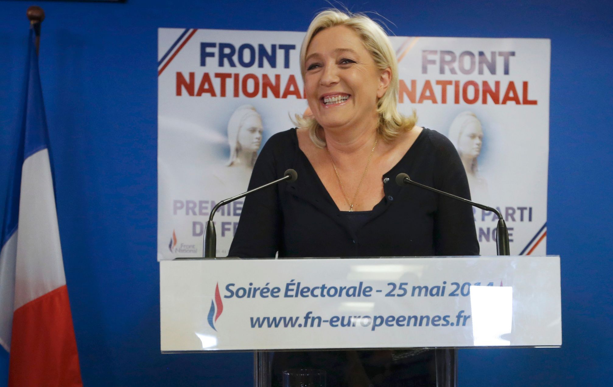 Marine Le Pen, France's National Front political party head, reacts to results after the polls closed in the European Parliament elections at the party's headquarters in Nanterre