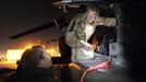 Britain's Prince Harry prepares his Apache helicopter before a night mission from Camp Bastion, southern Afghanistan in this photograph taken December 11, 2012, and released January 21, 2013. The Prince, who is serving as a pilot/gunner with 662 Squadron Army Air Corps, is on a posting to Afghanistan that runs from September 2012 to January 2013. Photograph taken December 11, 2012. REUTERS/John Stillwell/Pool (AFGHANISTAN - Tags: MILITARY POLITICS SOCIETY ROYALS CONFLICT) Published: Led. 21, 2013, 7:36 odp.