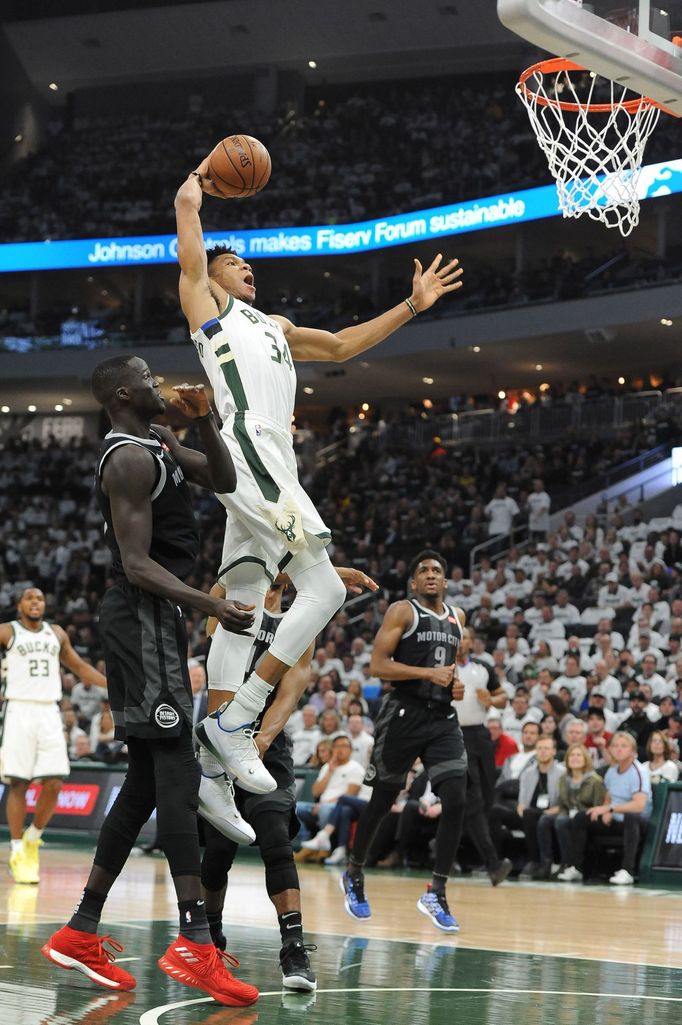 Apr 14, 2019; Milwaukee, WI, USA; Milwaukee Bucks forward Giannis Antetokounmpo (34) dunks against Detroit Pistons center Thon Maker (7) in the first quarter in game one