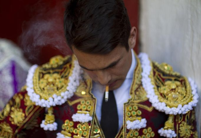 Spanish matador Jose Maria Manzanares smokes a cigarette before the start of a bullfight in Seville