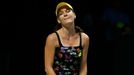 Agnieszka Radwanska of Poland reacts after losing a point against Petra Kvitova of the Czech Republic during their WTA Finals singles tennis match at the Singapore Indoor