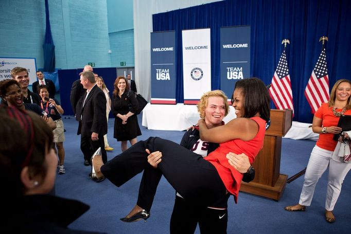 July 27, 2012 "Sonya Hebert captured this amusing moment as U.S. Olympic wrestler Elena Pirozhkova literally picked up the First Lady during a greet with Team USA Olympic athletes competing in the 2012 Summer Olympic Games in London."