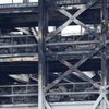 A view shows burnt vehicles in Terminal Car Park 2, following a fire at London Luton Airport, in Luton