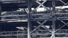 A view shows burnt vehicles in Terminal Car Park 2, following a fire at London Luton Airport, in Luton, Britain, October 11, 2023.  REUTERS/Peter Cziborra