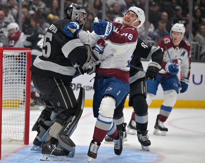 Oct 7, 2025; Los Angeles, California, USA;  Los Angeles Kings goaltender Darcy Kuemper (35) and Colorado Avalanche center Martin Necas (88) battle in front of the net dur