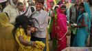 A man tries to hold a devotee who is believed to be possessed by evil spirits as she goes into a state of trance at Guru Deoji Maharaj temple during a ghost fair at Malajpur village in Betul district in the central Indian state of Madhya Pradesh January 27, 2013. People from across India come to this fair to be exorcised of �evil spirits�. They are usually brought by relatives and they are most often women. The exorcism involves running around the temple courtyard to make the 'ghost' weak then being beaten by a priest with a broom. Picture taken January 27, 2013. REUTERS/Danish Siddiqui (INDIA - Tags: SOCIETY RELIGION) ATTENTION EDITORS: PICTURE 2 OF 24 FOR PACKAGE 'INDIAN GHOSTBUSTERS' SEARCH 'INDIA GHOST' FOR ALL IMAGES Published: Úno. 5, 2013, 5:09 dop.